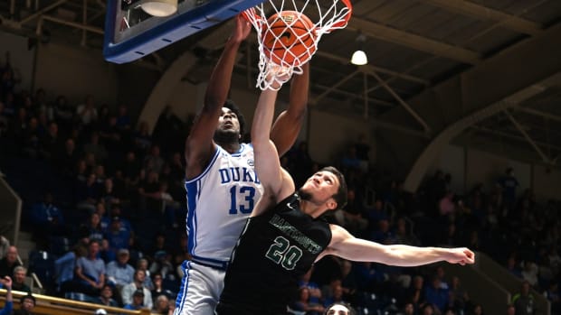 Duke Blue Devils forward Sean Stewart (13) dunks over Dartmouth Big Green guard Romeo Myrthil (20) during the second half at Cameron Indoor Stadium in Durham, North Carolina, on Nov. 6, 2023.
